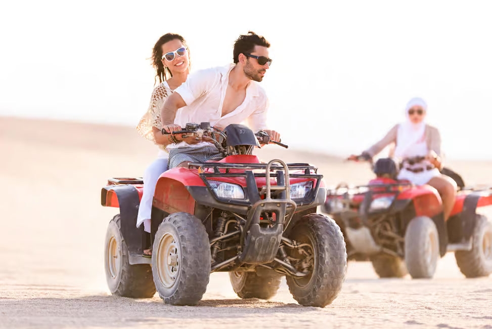 Quad adventure through the Omani desert dunes