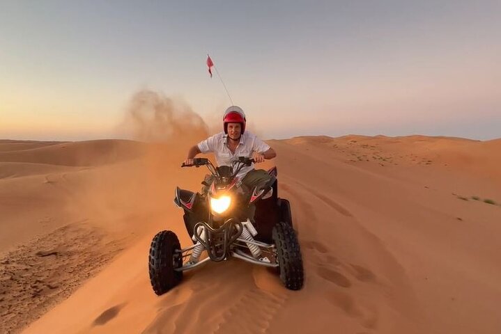 Quad adventure through the Omani desert dunes