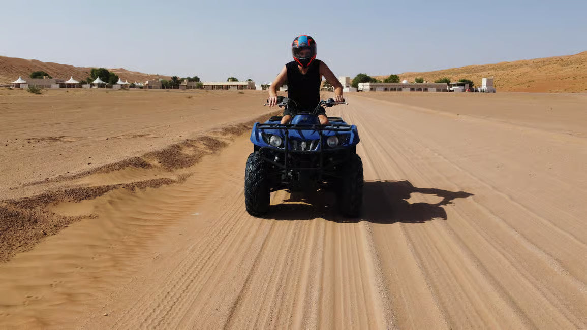 Quad adventure through the Omani desert dunes